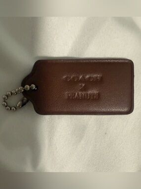 Coach and Peanuts Collab brown Hangtag!